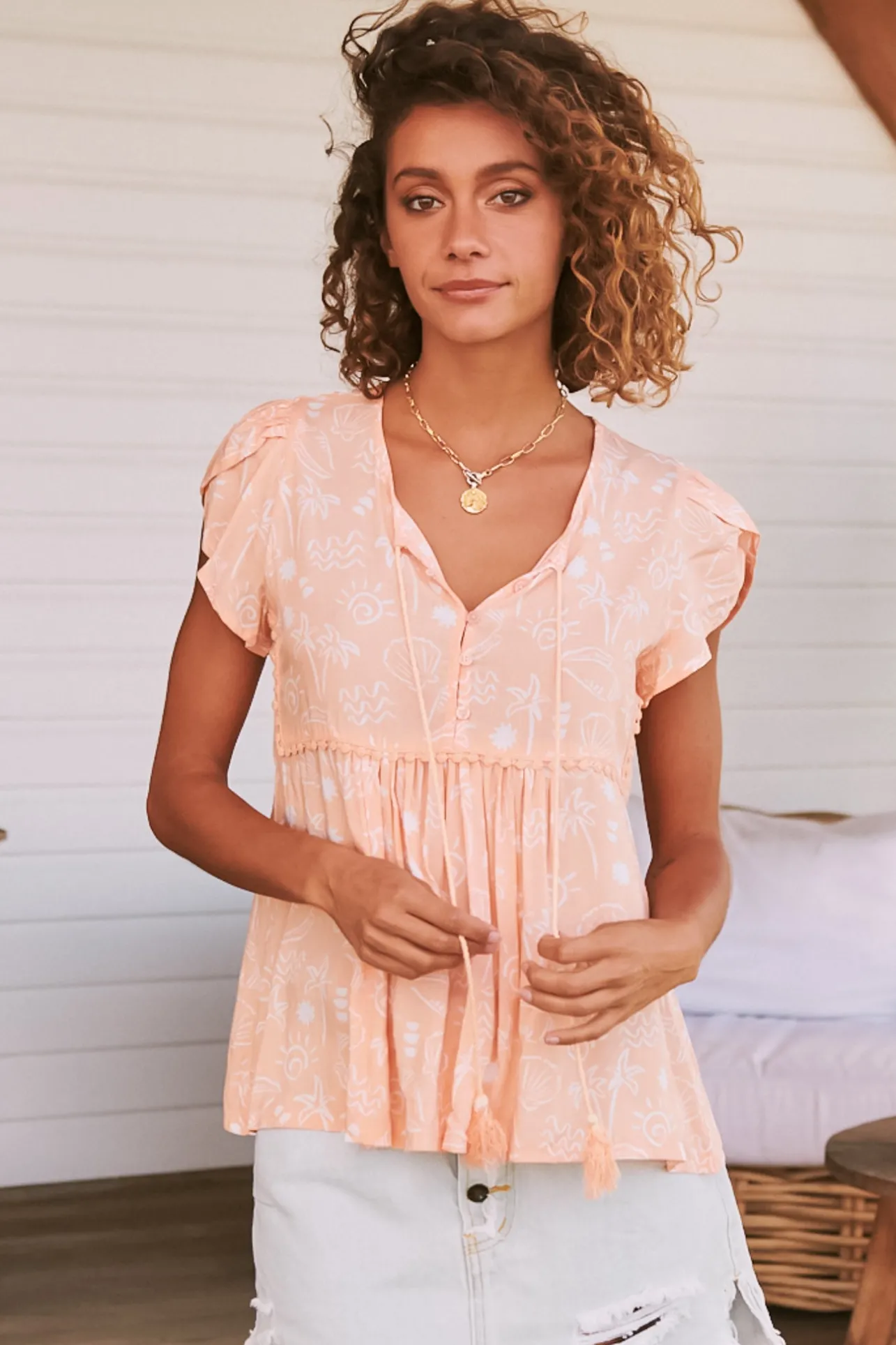 - Ella Top: Butterfly Cap Sleeve Smock Top with Neck Tie in Peach Island Print>Jaase Outlet