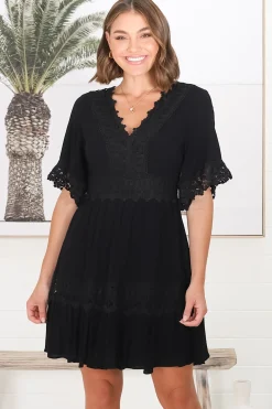 Leelie Mini Dress - Lace Embellished Tiered Dress with Bell Sleeves in Black><noscript><img width=
