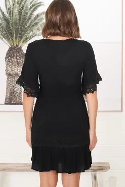 Leelie Mini Dress - Lace Embellished Tiered Dress with Bell Sleeves in Black><noscript><img width=